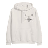 Image of the front of a bone colored hoodie against a white background. The left chest features two small black checkerboard designs. Below in black is the track listing to tinashe's album "333". over top of the words in black text reads "tinashe 333".