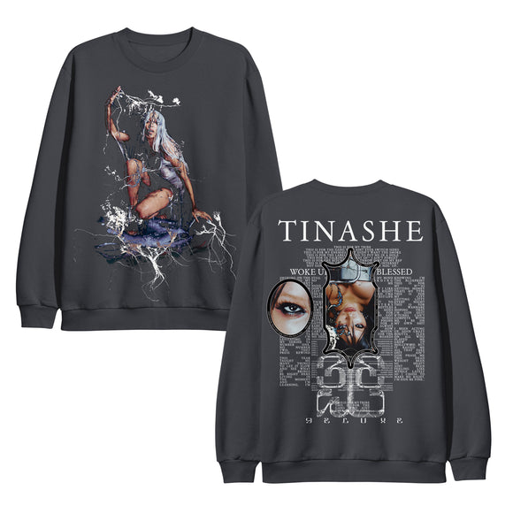 image of the front and back of a charcoal crewneck sweatshirt on a white background. front of the crewneck is on the left and has a full bdy print of tinashe. the back of the crewneck is on the right and has a full back print in white that says tinashe at the top across the shoulders, below are two photos of tinashe surrounded by song lyrics for this is for my tribe.