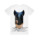 image of the front of a white tee shirt on a white background. front of the tee has a full body print of tinashe's left side of her face with lightning bolts below and in black across the bottom says tinashe ladyland new york june 17 2022