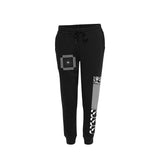 Photo of front of Tinashe 333 black joggers. Front has white  square art image on upper right leg and Tinashe 333 logo and checkered pattern print in white on lower left leg. 