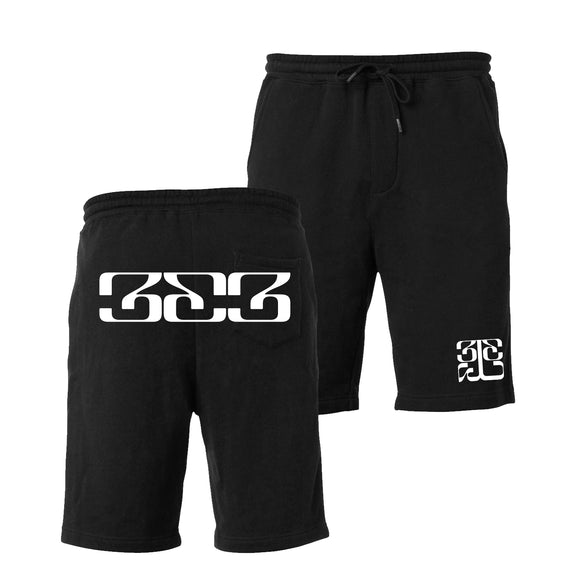 Photo of the front and back of the Tinashe 333 logo black shorts.  Back of shorts features large 333 logo text across butt and pocket of shorts.  Front photo has small white Tinashe 333 logo in white on the left leg of shorts.  