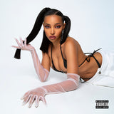 Image of the Tinashe songs for you album artwork. The artwork features a photo of tinashe lying on her stomach while wearing a black bikini and white jeans. She has long white gloves on. One hand is resting on the ground, and the other is propped up by her elbow in a sassy position, holding one of her pigtails.